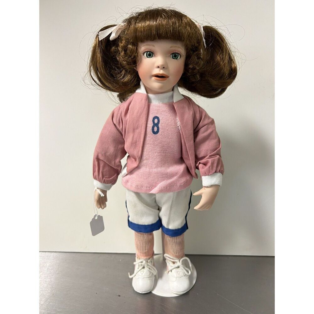 Paradise Galleries Little Sports Coll. ALEX 14" Porcelain Doll with A Stand.